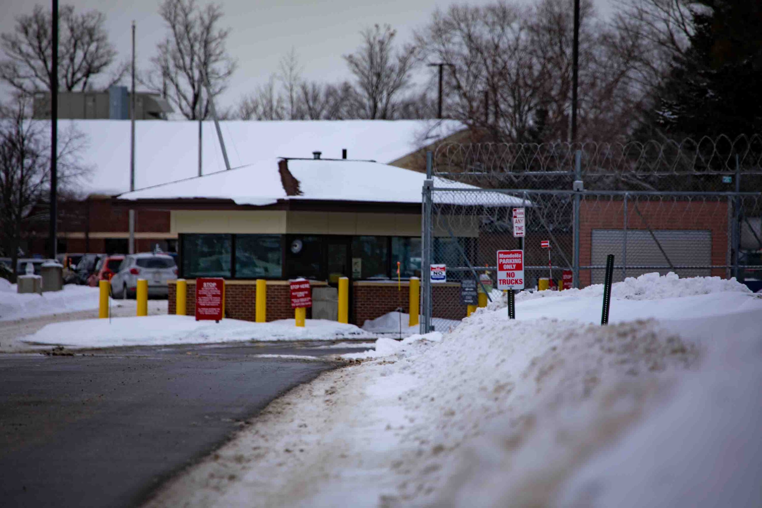 Outside Batavia, NY's ICE Detention Center sits a barbed wire fence covered in snow.