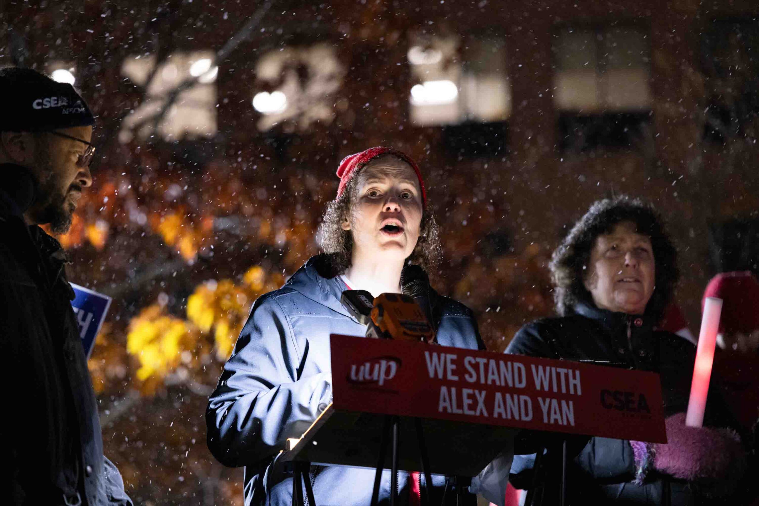 At a night protest, the UUP Upstate Chapter President speaks to the crowd.