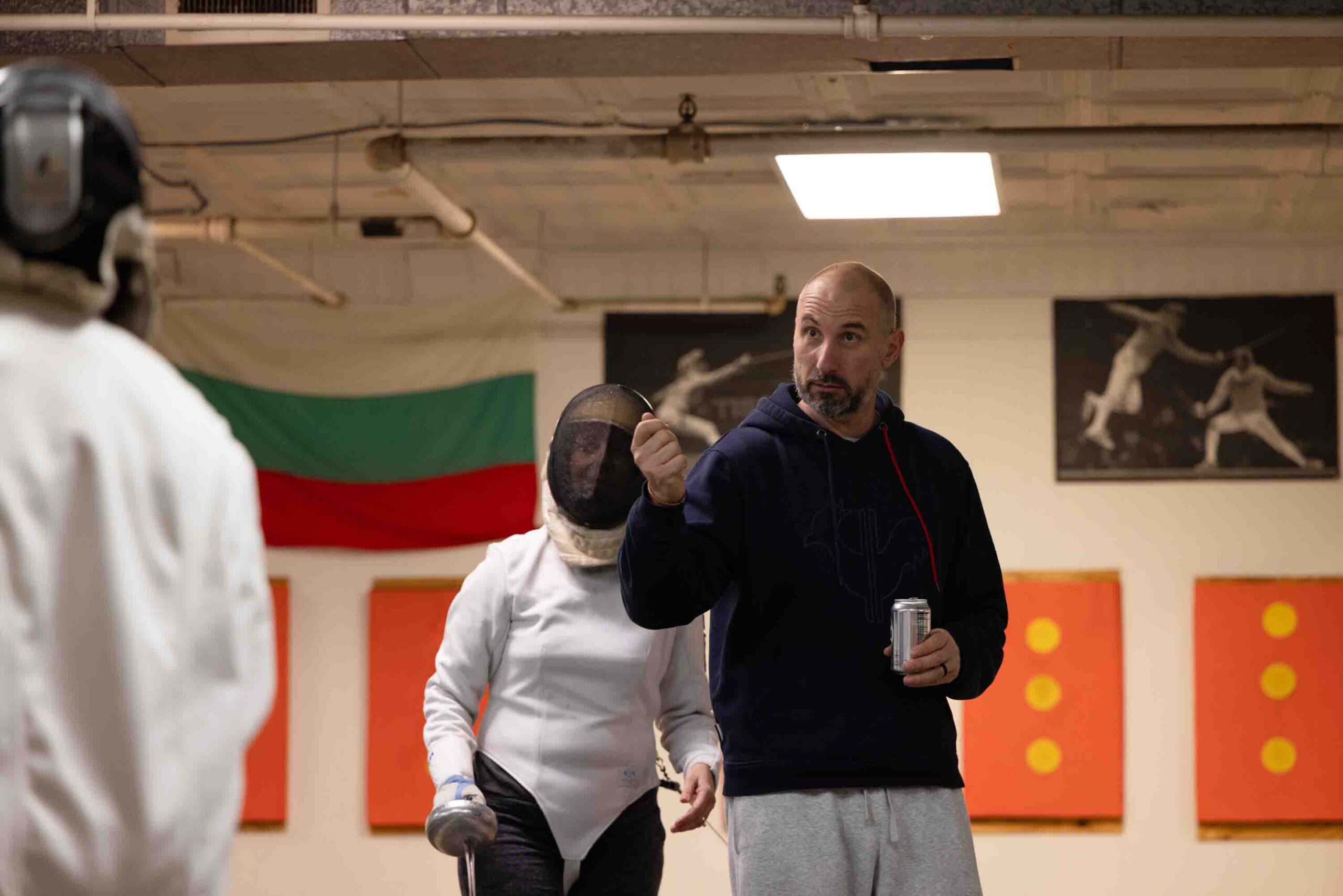 Kalpaktchiev instructs students on technique during practice in the Syracuse Musketeers Fencing Club.