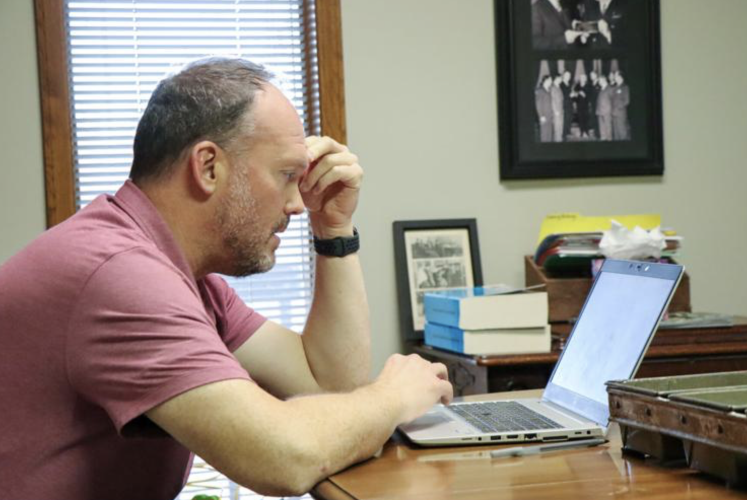 Brian Blackford looks over documents on his computer.