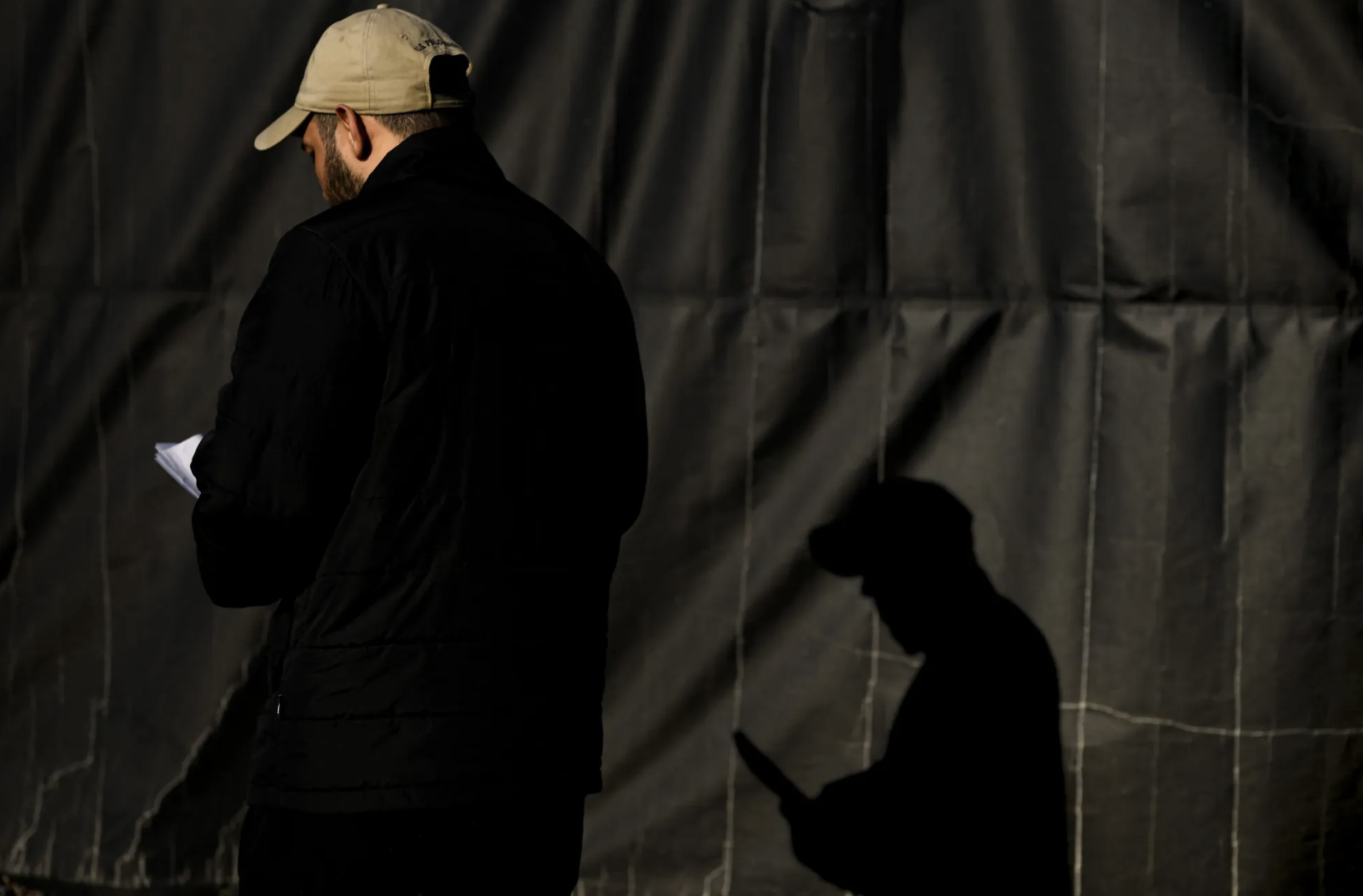 Rafael, in a brown baseball hat, prepares to walk into his appointment with U.S. Immigration and Customs Enforcement in Syracuse, New York.