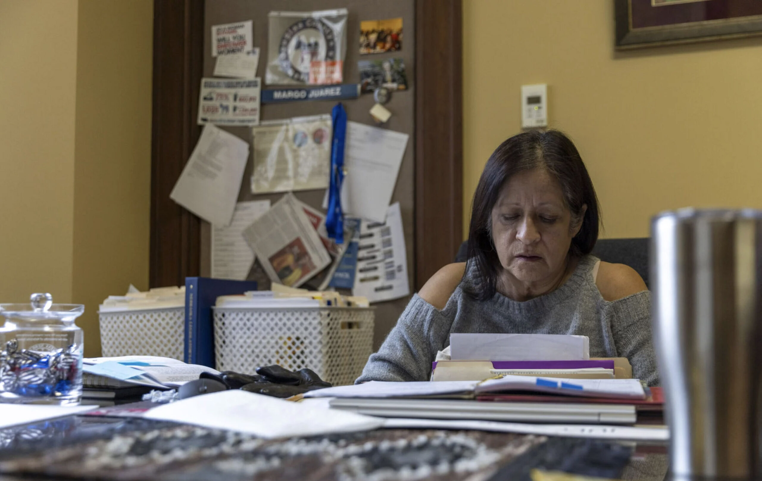 State Sen. Margo Juarez of Omaha sifts through papers in her office in the Nebraska State Capitol on Tuesday, Oct. 28, 2025, in Lincoln.