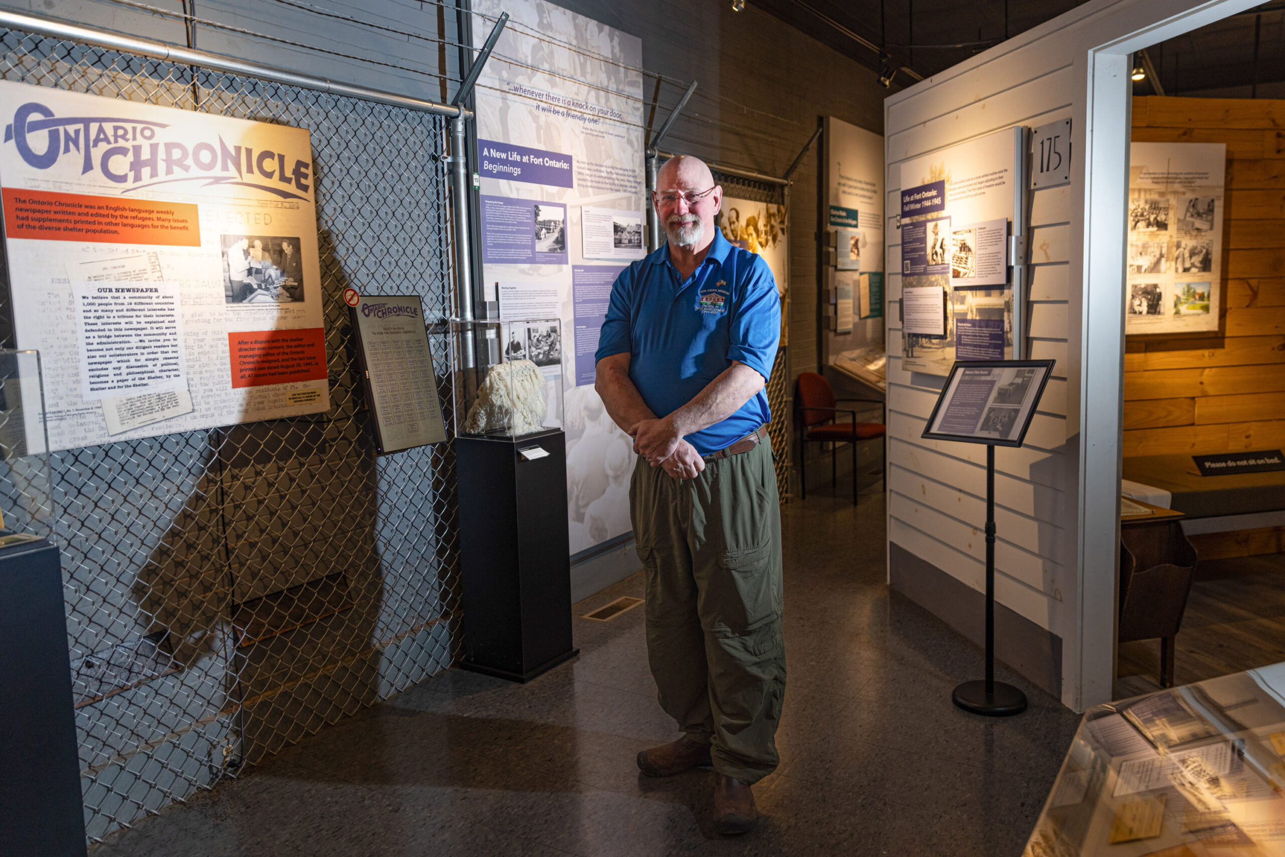 Safe Haven Holocaust Refugee Shelter Museum president Paul Lear stands in the exhibit room of the museum.
