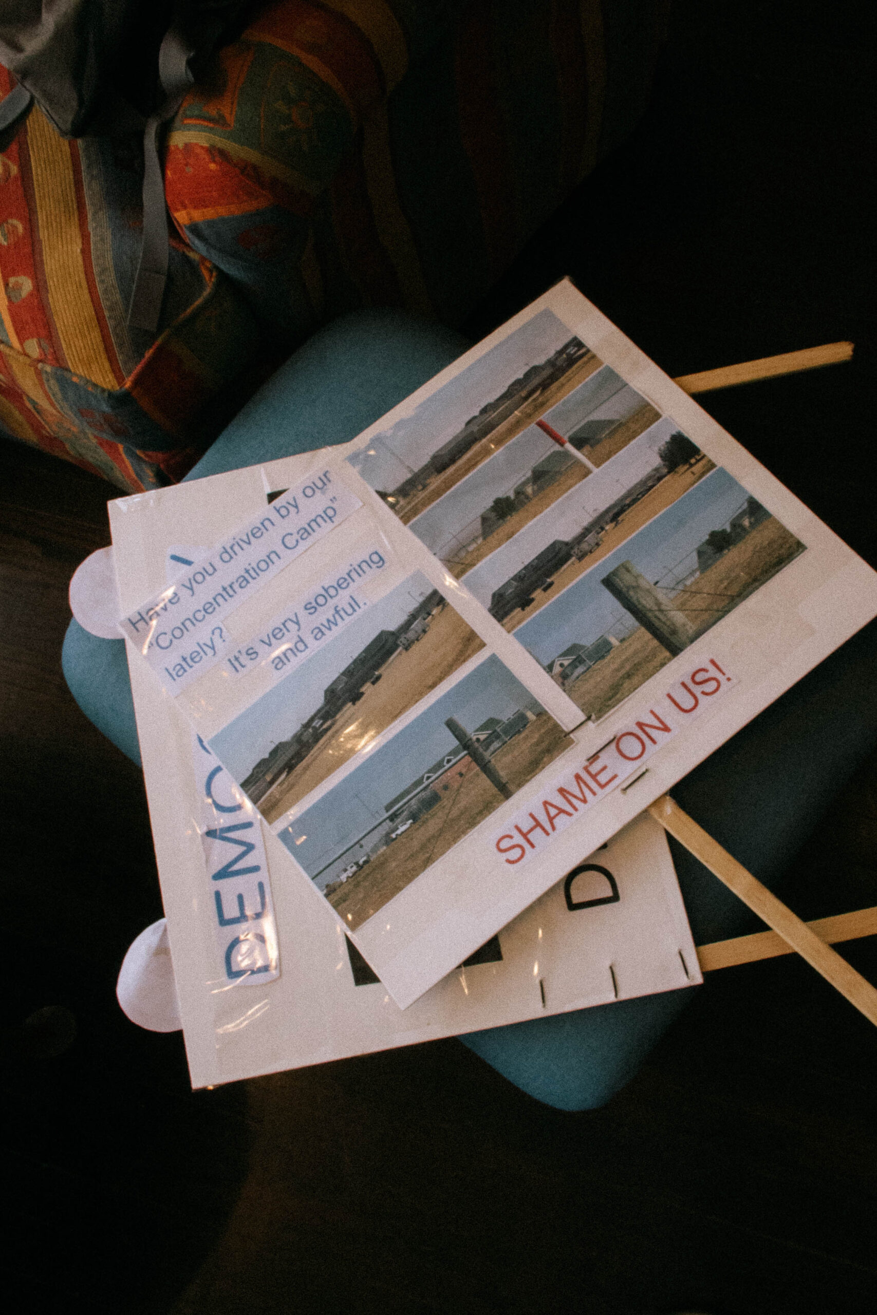 Two signs to be used during a No Kings Day protest on March 28, 2026, condemn the usage of WEC as an ICE detention facility.