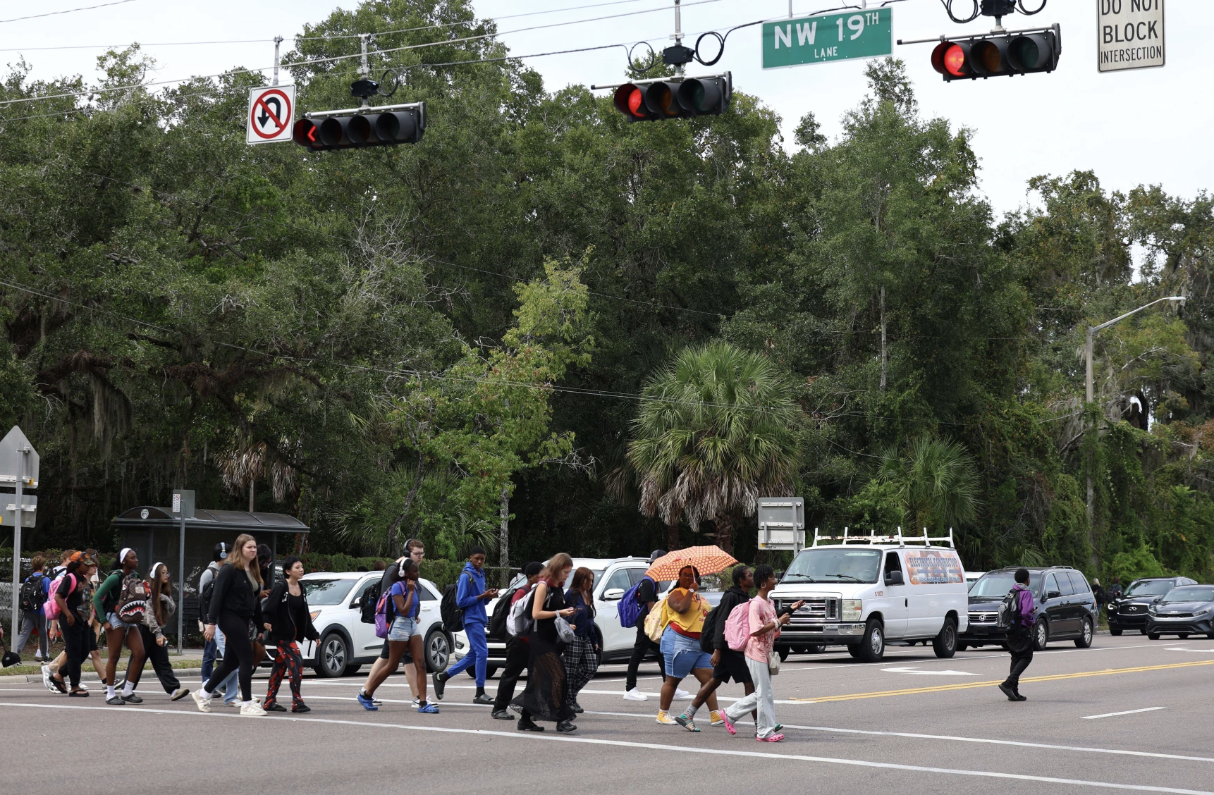 Gainesville High School students cross SW 13th St. after school let out in Gainesville, Florida.