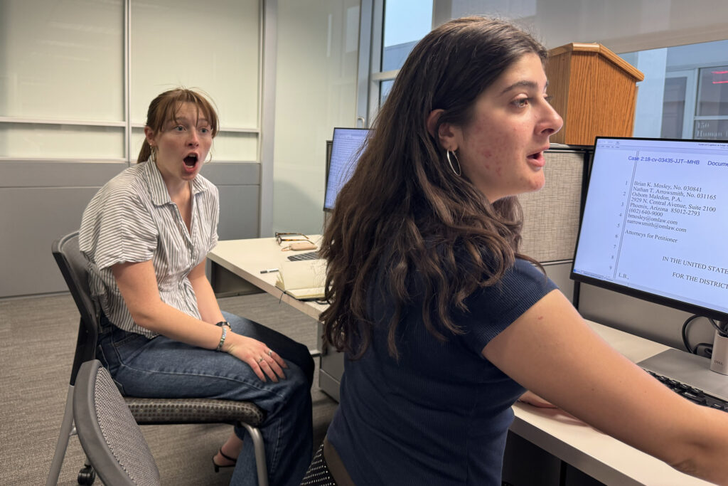 Howard Center reporters Sophie Schaeffer and Katrina Michalak, based at ASU's Cronkite School of Journalism, sift through habeas corpus petitions electronically.