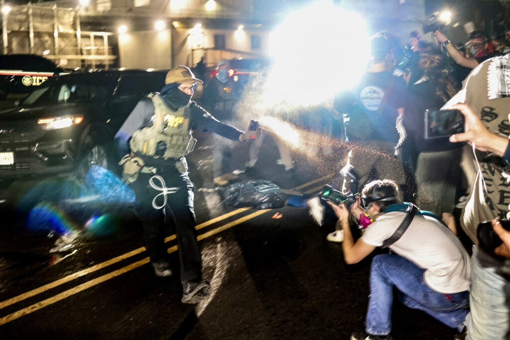 Syracuse photojournalist Ike Wood (right) captures protests at Delaney Hall detention center in Newark, N.J.