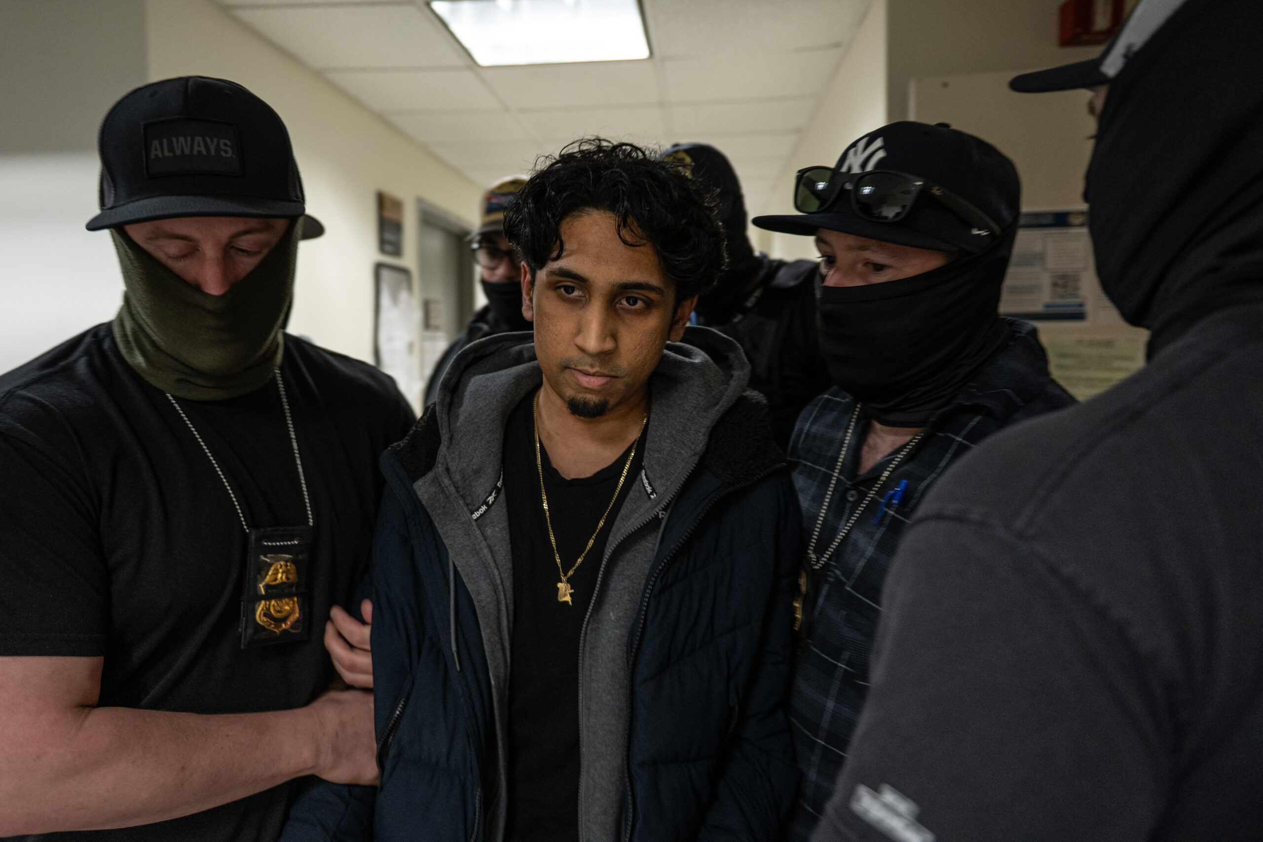 A young man arrives for an immigration check-in at 26 Federal Plaza in New York on March 10, 2026. After agents detained him, they told journalists he was a wanted sex offender. Court observer Peter Melck disputed the claim, saying it is routine for ICE agents to characterize detainees that way and urged journalists to treat such statements with skepticism.