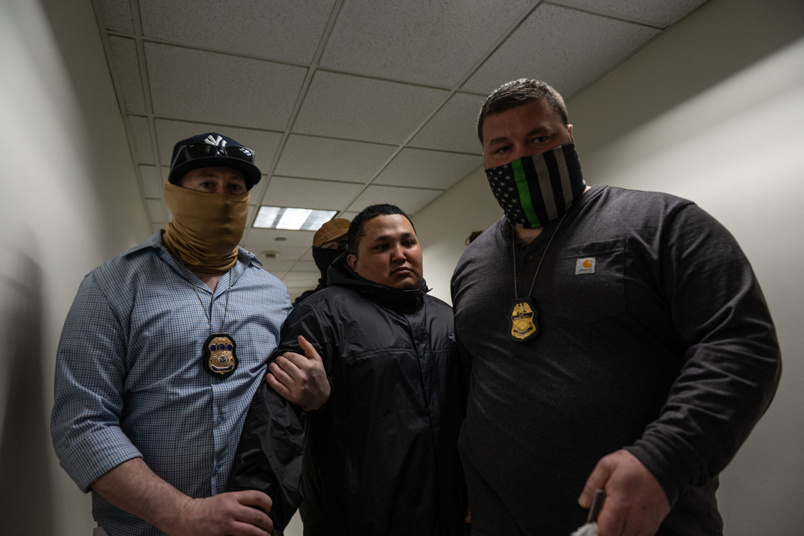 Federal agents detain a young man after he exits a courtroom on the 14th floor of the Jacob K. Javits Federal Building in New York on March 10, 2026.
