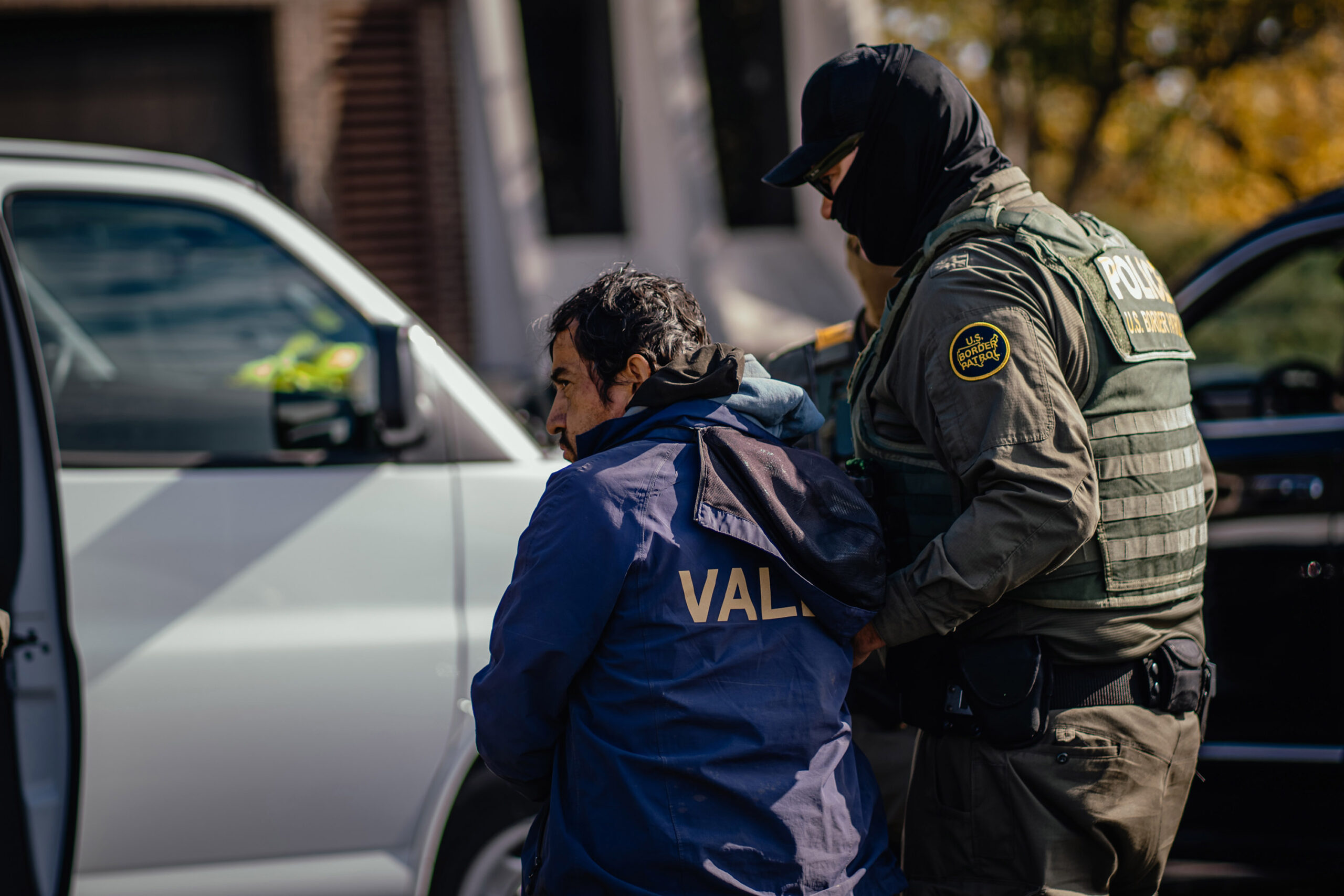 U.S. federal agents detain a man during an immigration raid in a residential neighborhood on the far north side of the city on October 31, 2025, in Chicago, Illinois. The operation was carried out as part of President Donald Trump's administration's "Operation Midway Blitz," an ongoing immigration enforcement surge across the Chicago region.