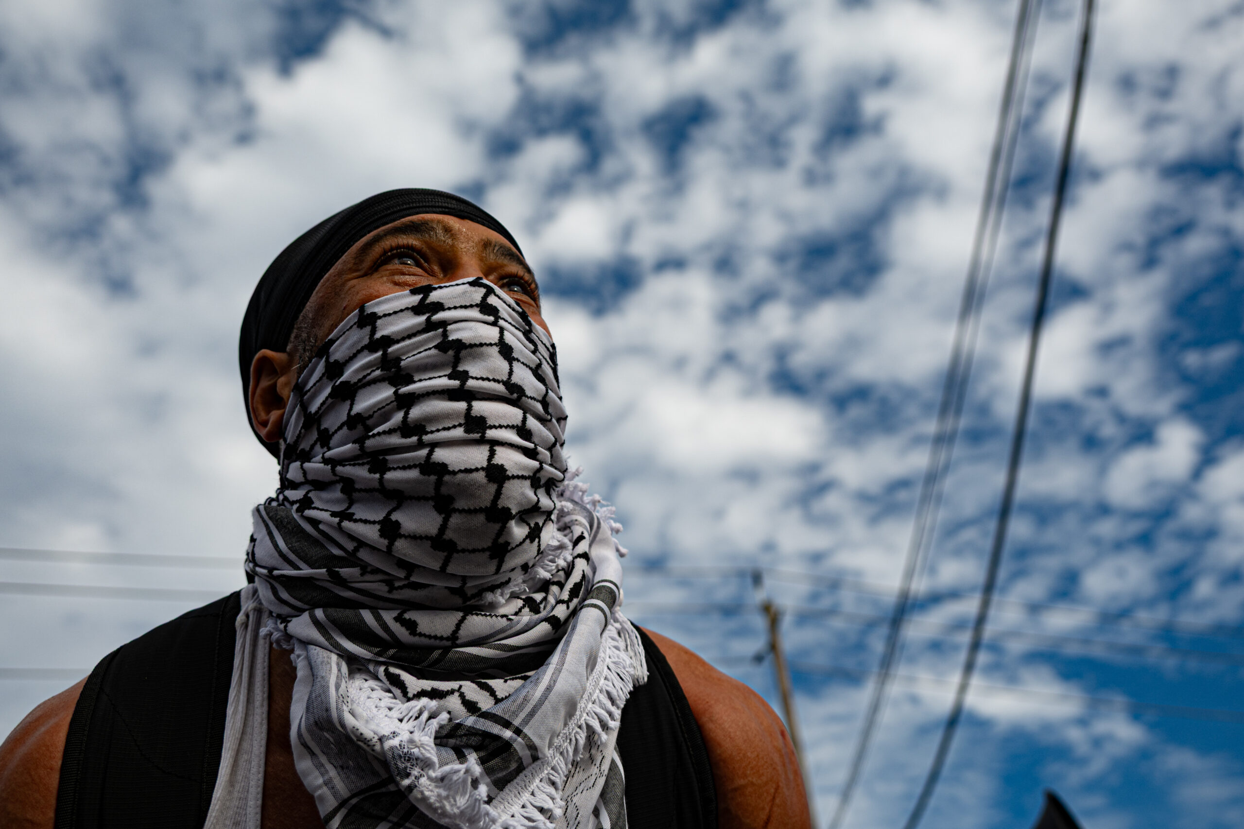 A protester chants anti-ICE slogans at federal agents alongside approximately 50 demonstrators outside Delaney Hall detention center in Newark, N.J., on May 26, 2026.