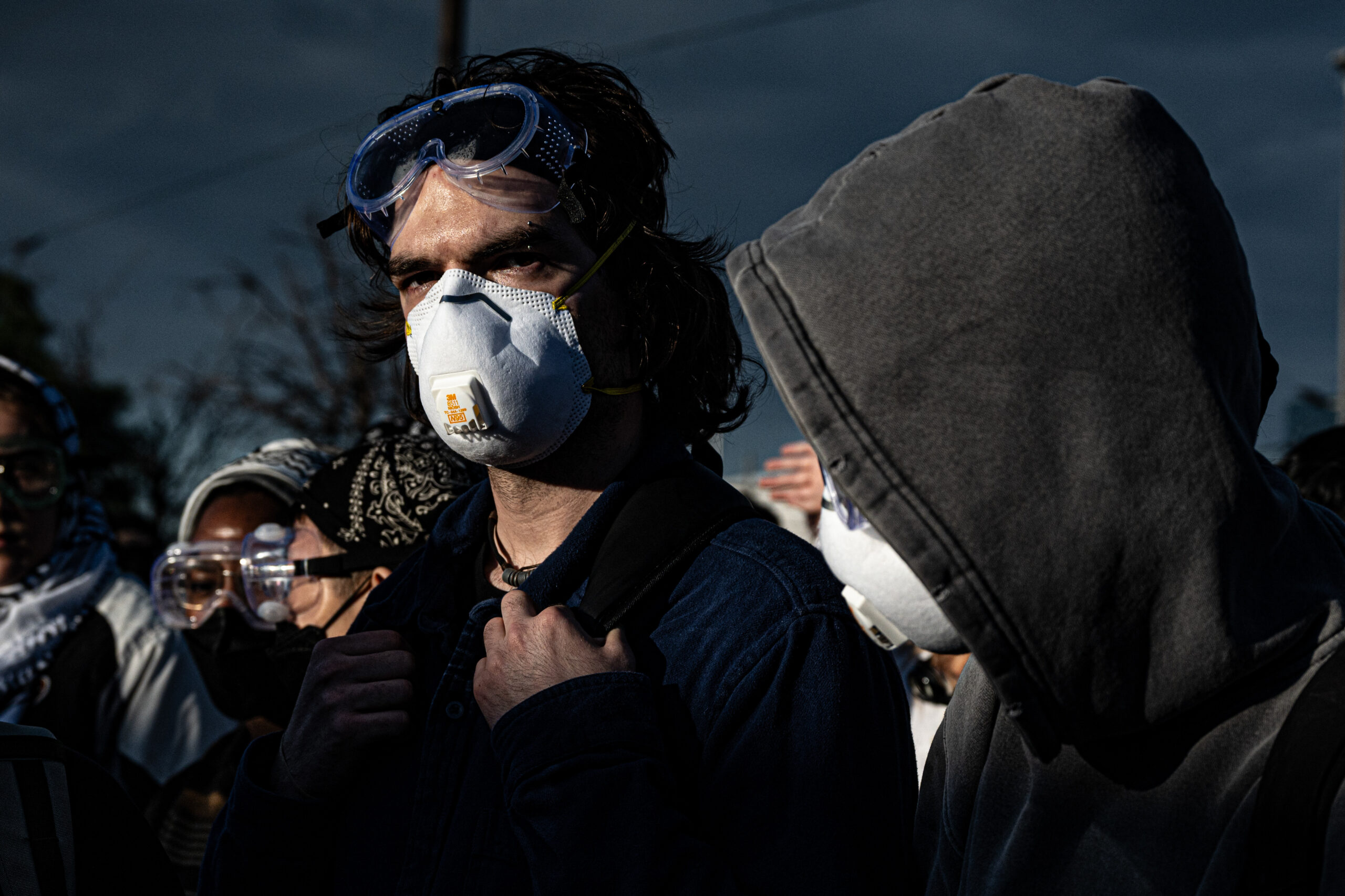 Protesters and federal agents face off in the evening light as skirmishes continue outside Delaney Hall detention center in Newark, N.J., on May 27, 2026.