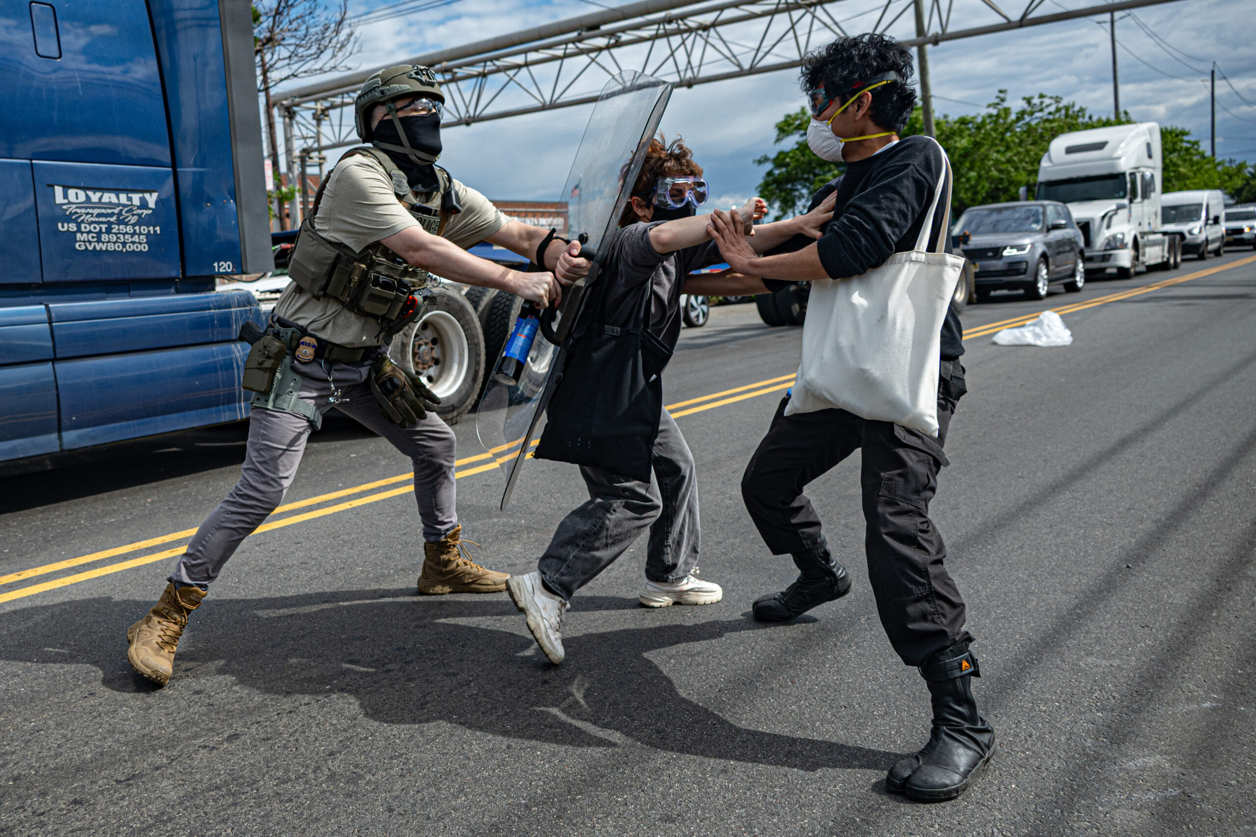 Protesters and federal agents clash over control of the driveways leading into Delaney Hall detention center in Newark, N.J., on May 28, 2026.