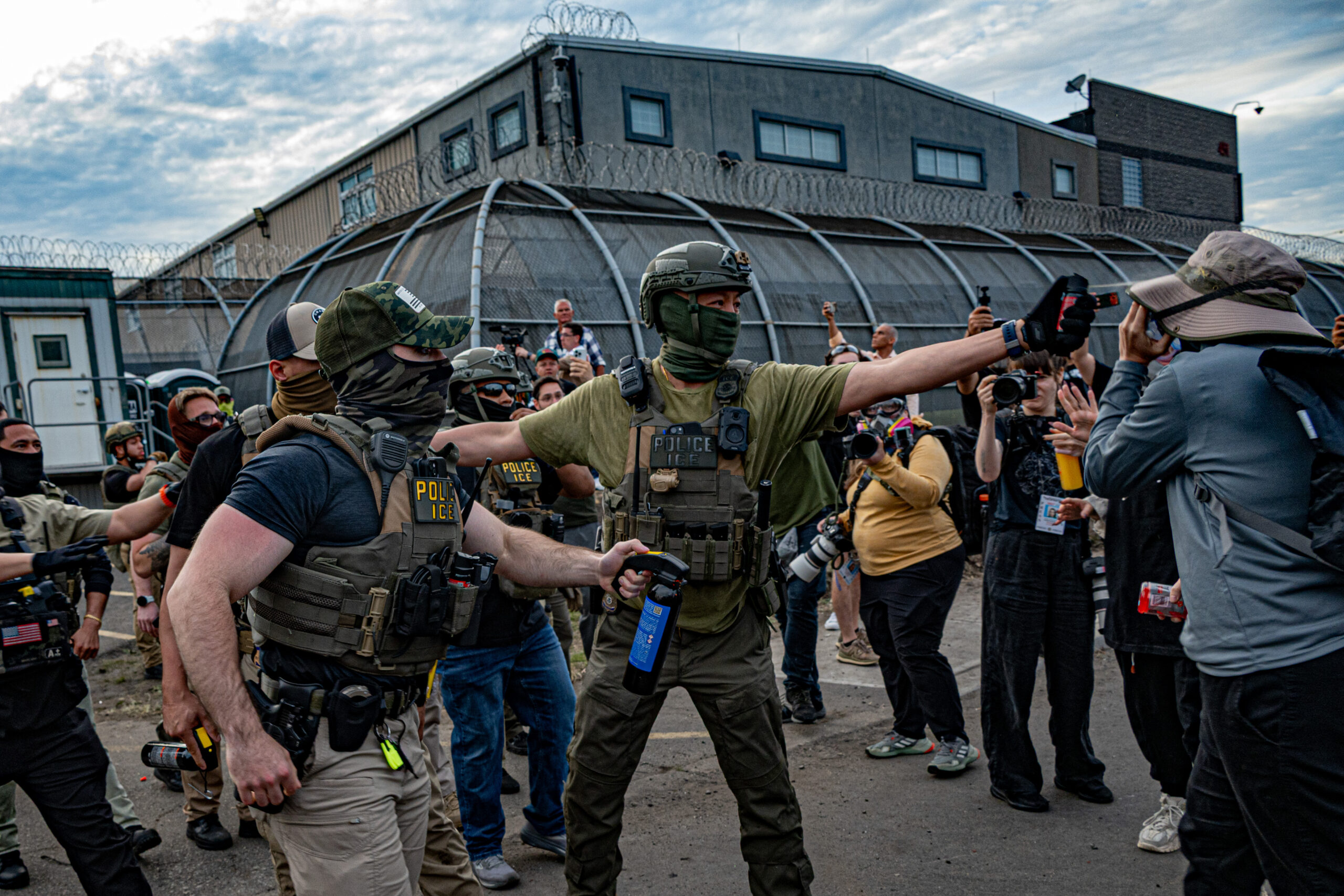 Federal agents advance on protesters while deploying chemical irritants outside Delaney Hall detention center in Newark, N.J., on May 26, 2026.