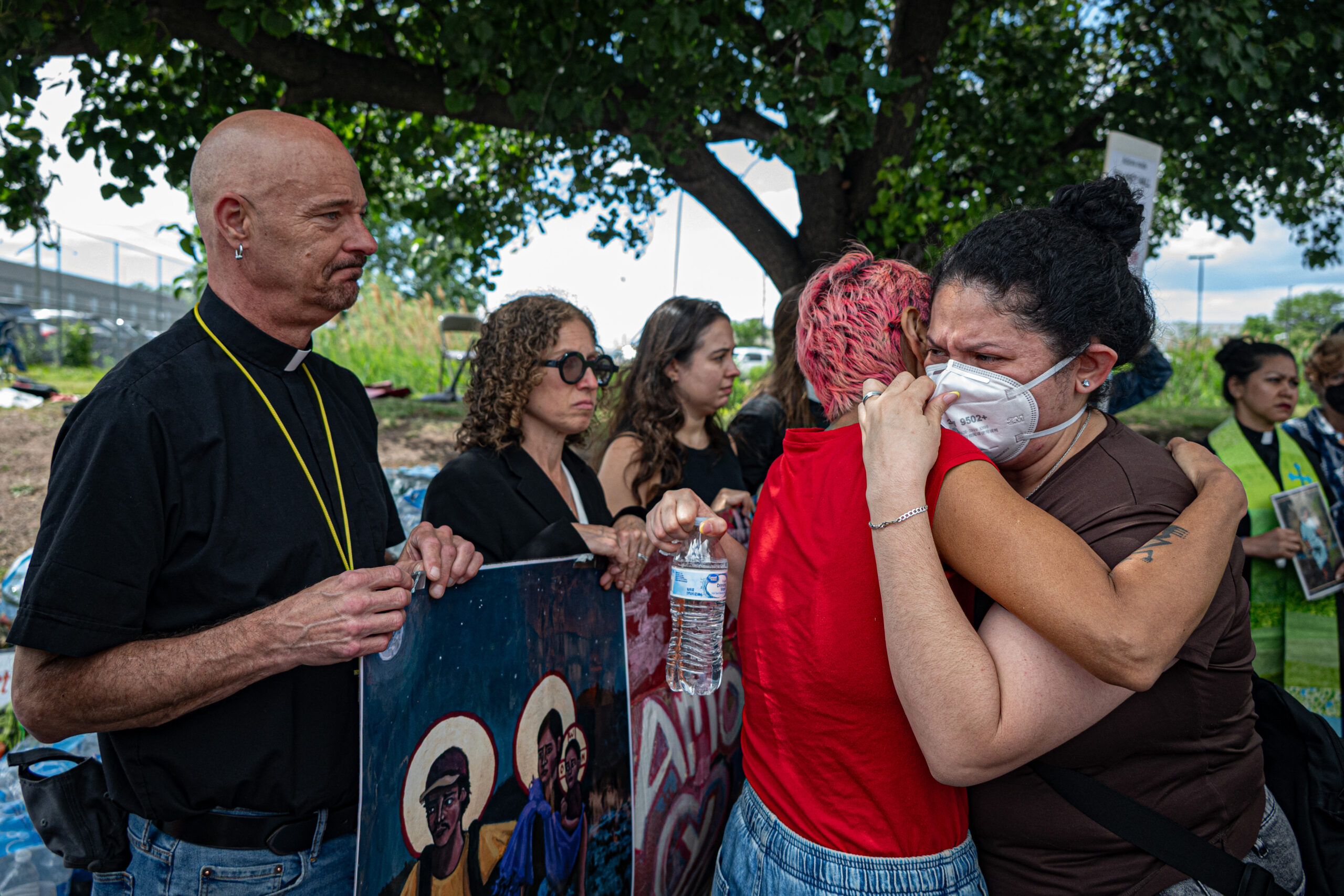 Clergy members struggle to hold back tears as Gabriela Soto, the pregnant wife of a Delaney Hall detainee, describes conditions inside the facility outside the Newark, N.J., detention center on May 28, 2026. "They are going cell to cell and gassing them. They beat them and took their translator. My husband is suffering inside, they are hitting my husband," Soto said.