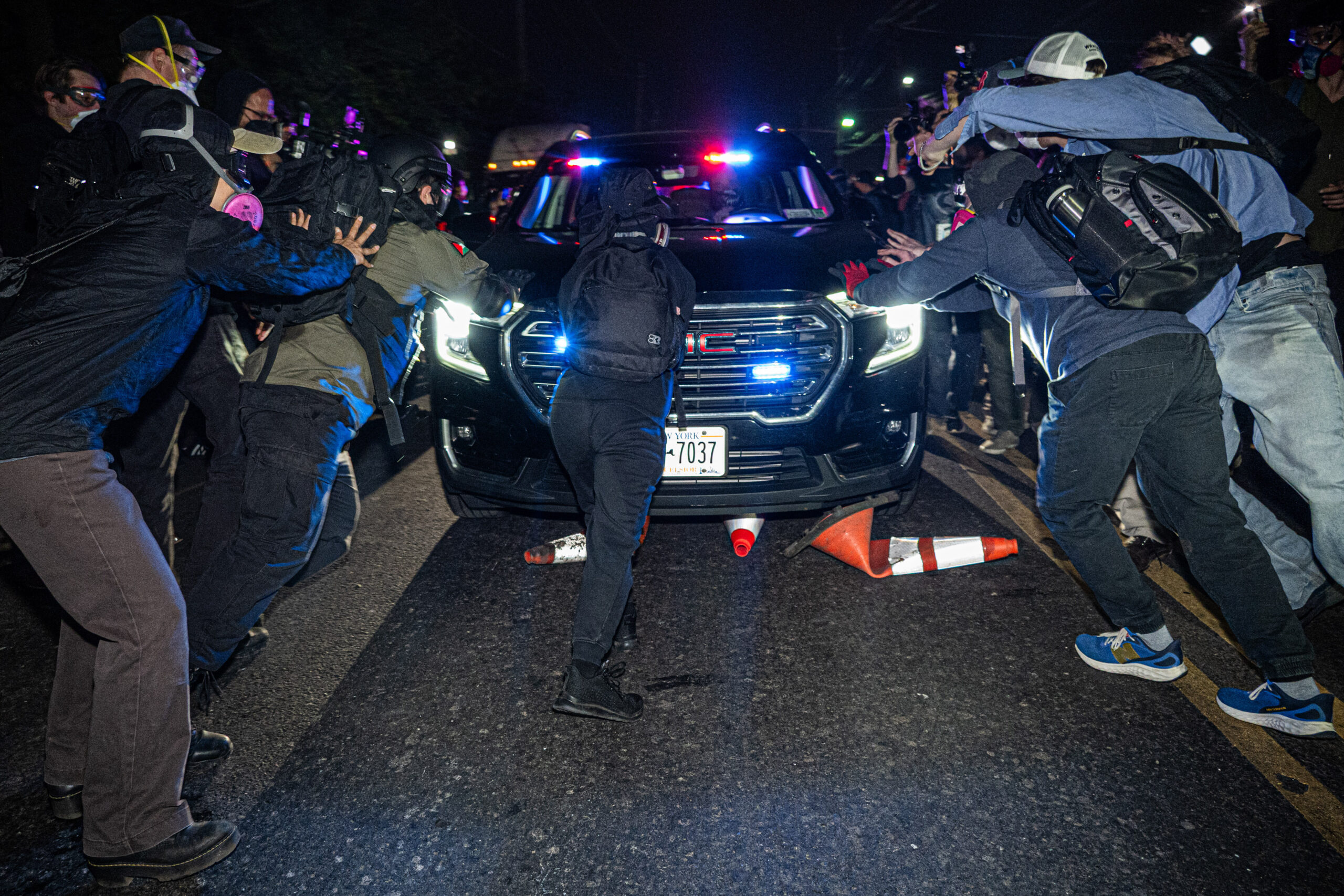 Protesters push back against incoming federal vehicles attempting to enter Delaney Hall immigration processing facility during a lull in the police riot in Newark, N.J., on May 29, 2026.