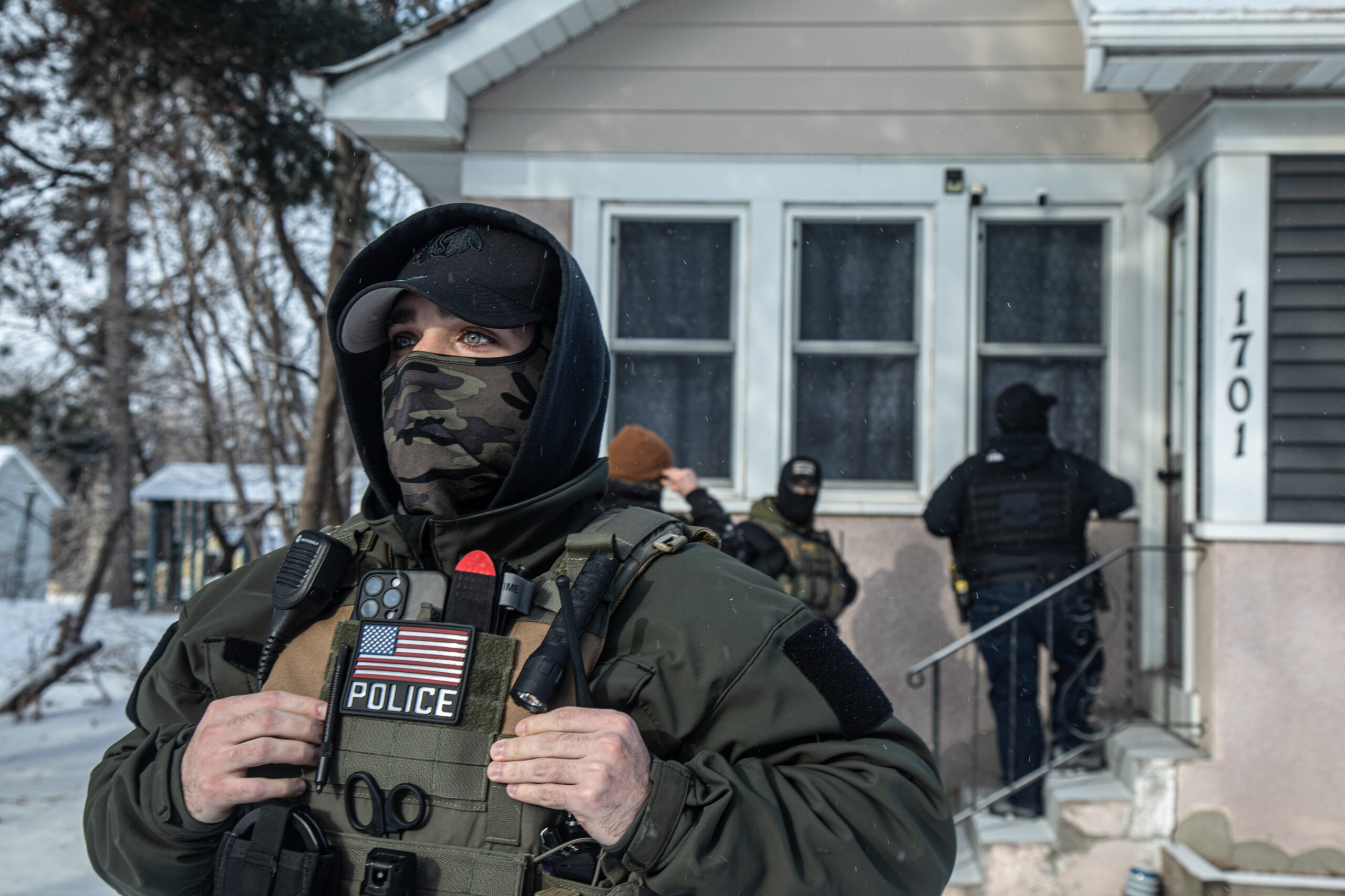 ICE and Enforcement and Removal Operations agents attempt a home raid in a St. Paul, Minn., neighborhood while community members gather to observe on Jan. 18, 2026. Agents threatened to deploy pepper spray against legal observers, attempted to intimidate them and stepped on their shoes.