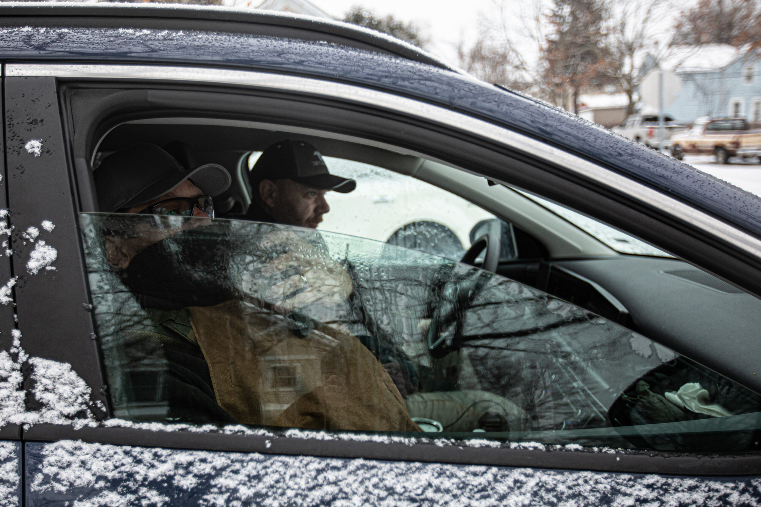 Federal agents record the faces of legal observers outside a home in St. Cloud, Minn., where agents had identified a target on Jan. 18, 2026. The agents planned to upload the footage to a facial recognition database upon returning to their base of operations, according to the current administration.
