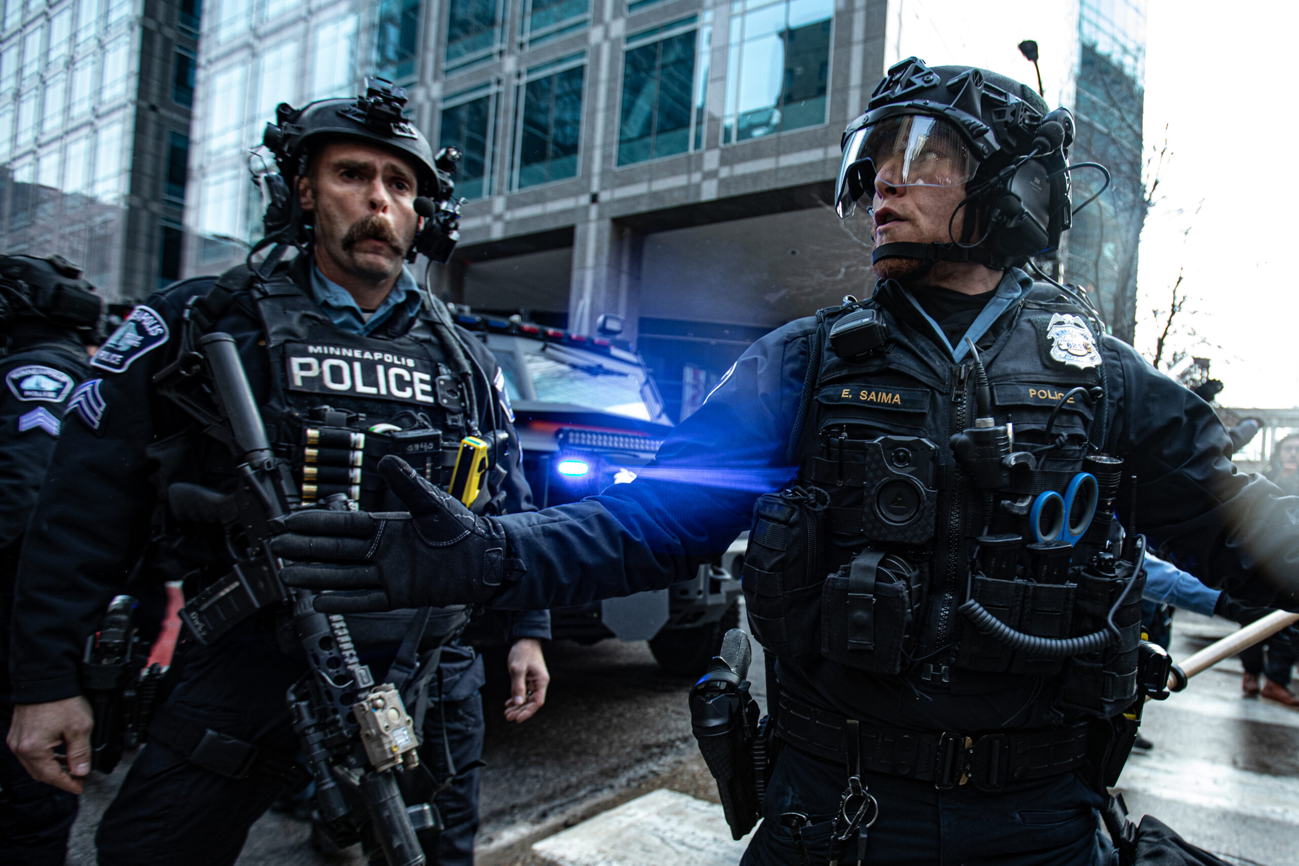Minneapolis police, stationed nearby with an armored vehicle, largely maintained a neutral posture throughout, though officers asked demonstrators to remain on sidewalks as marchers flooded downtown streets.